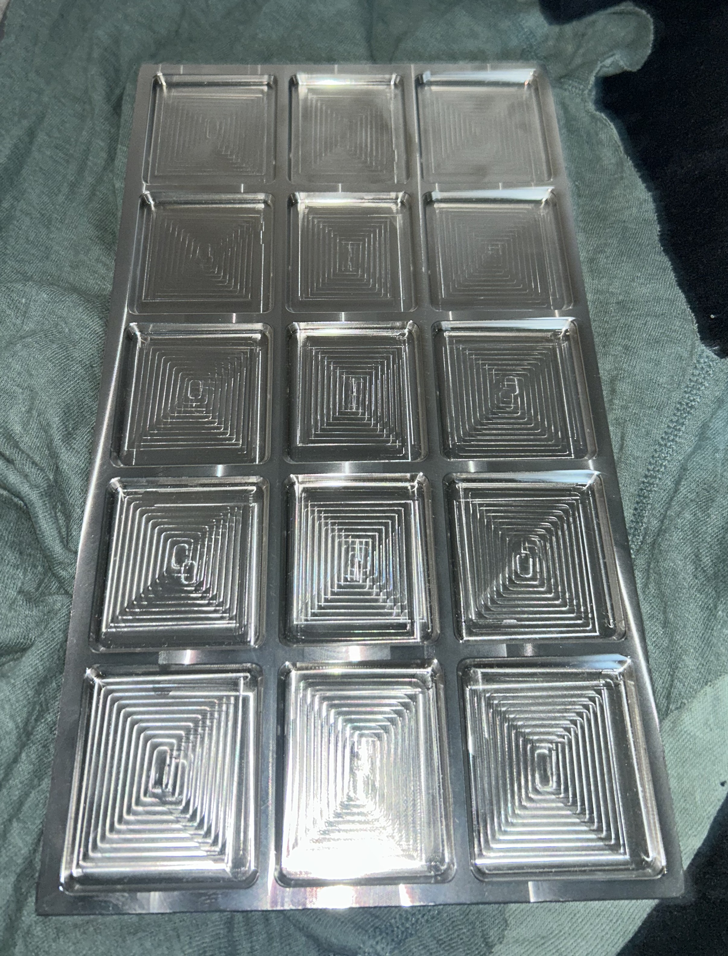 Precision machined stainless steel pocket mould — 12-cavity batch